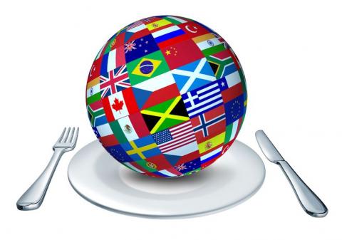 Globe with flags on plate