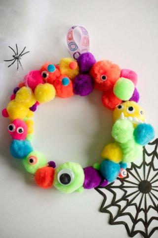 Pom Pom wreath with googly eyes