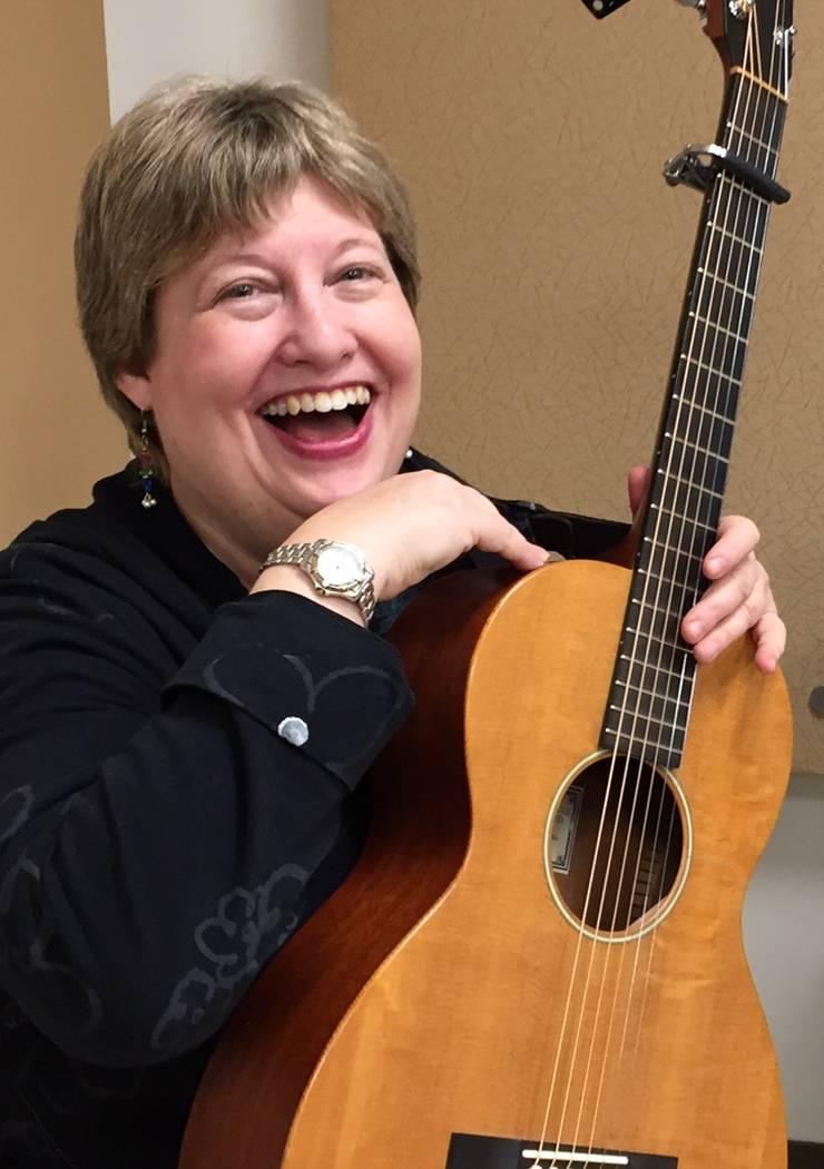 sue fink with guitar